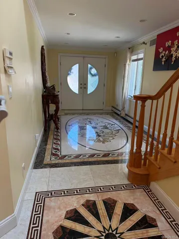 a view of a livingroom with furniture and staircase