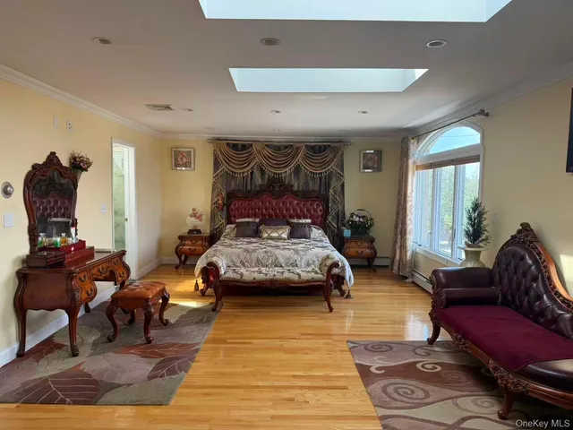 a bedroom with furniture and a rug