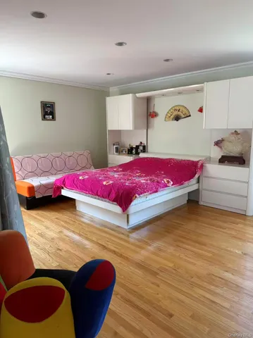 a bedroom with a bed and a couch