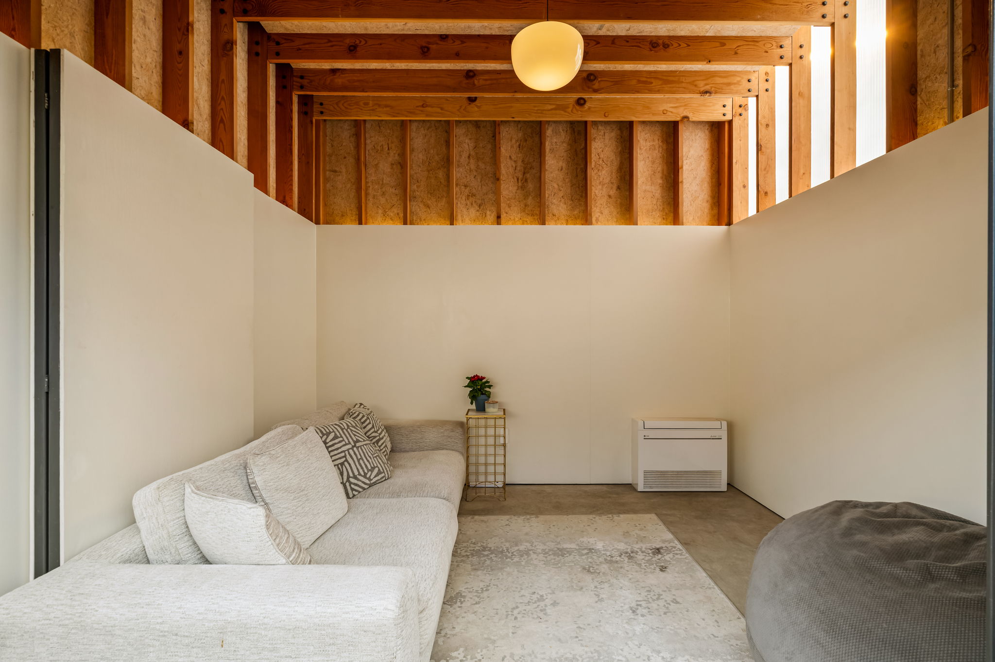 1124 Linden Street, Unit B Austin, TX 78702 - Photo 23 of 26 Living area with a high ceiling and concrete floors