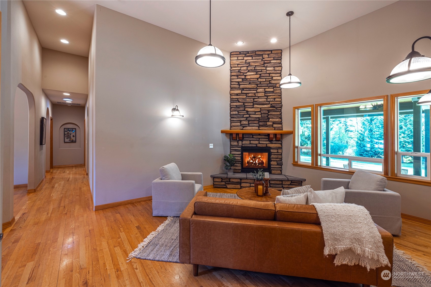 6055 East Hemmi Road Bellingham, WA 98226 - Photo 20 of 40 a living room with furniture and a fireplace