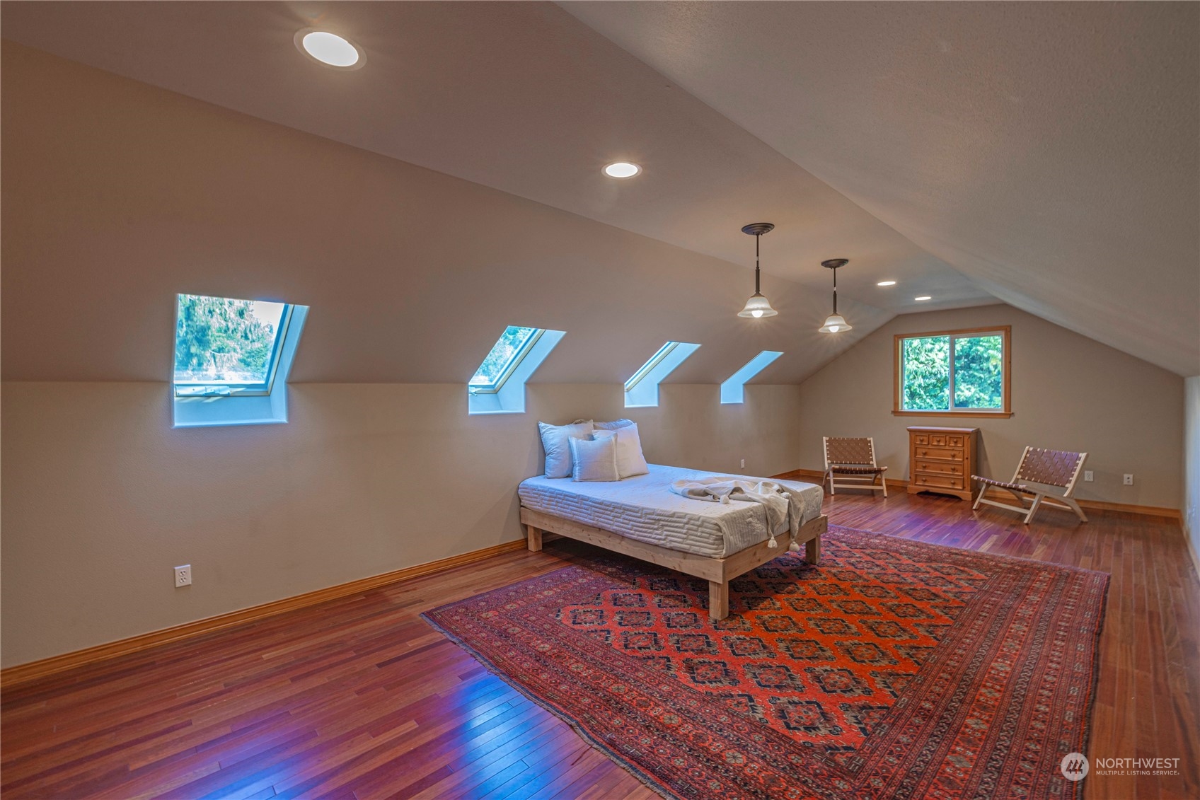 6055 East Hemmi Road Bellingham, WA 98226 - Photo 31 of 40 a living room with furniture and a wooden floor