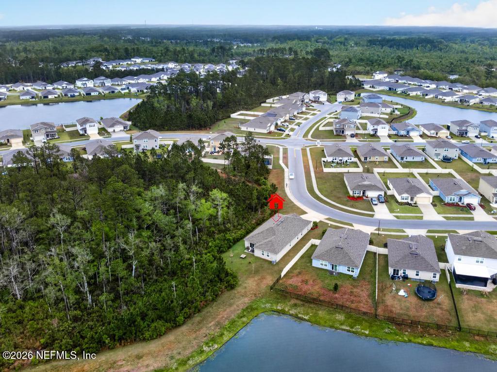 70144 Roseapple Court Yulee, FL 32097 - Photo 32 of 41 an aerial view of residential house with outdoor space