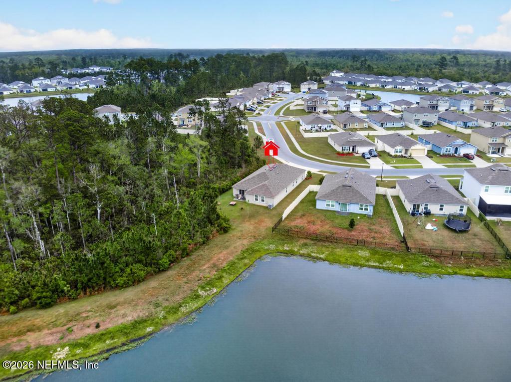 70144 Roseapple Court Yulee, FL 32097 - Photo 33 of 41 an aerial view of a house with a garden