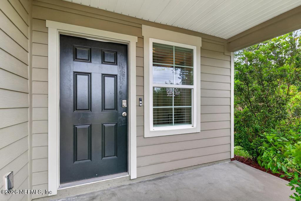 70144 Roseapple Court Yulee, FL 32097 - Photo 5 of 41 a view of front door of a house