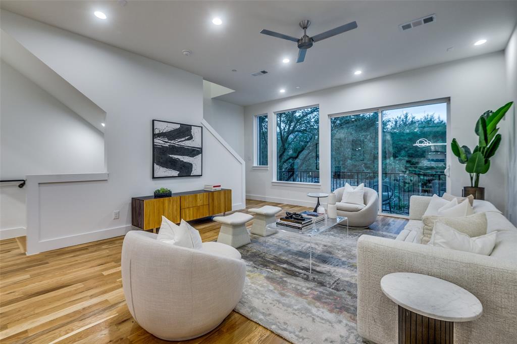 14911 Reserve Circle Addison, TX 75001 - Photo 5 of 18 a living room with furniture and a large window