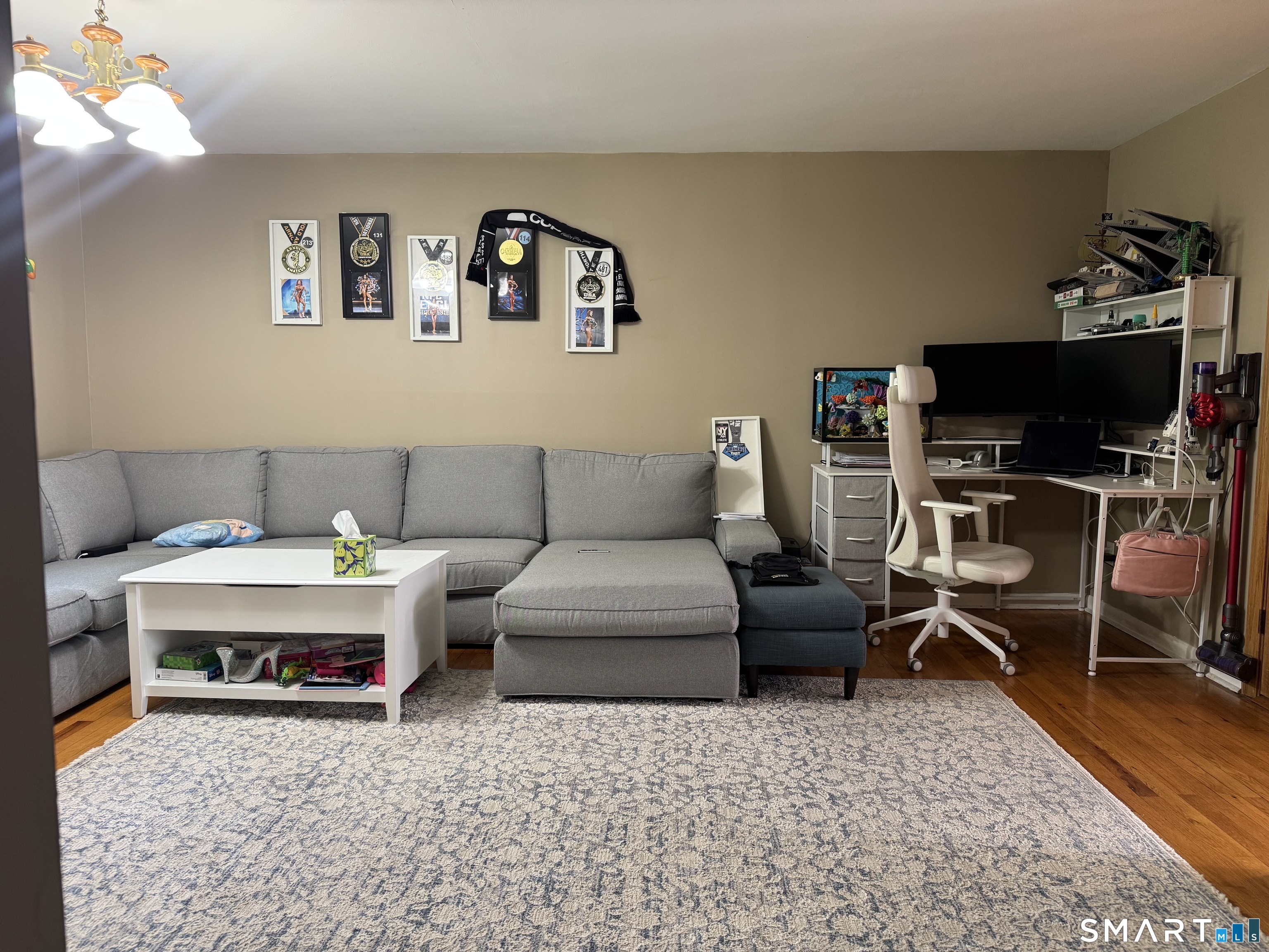 480 Radmere Road, Unit B Cheshire, CT 06410 - Photo 5 of 13 a living room with furniture and a flat screen tv