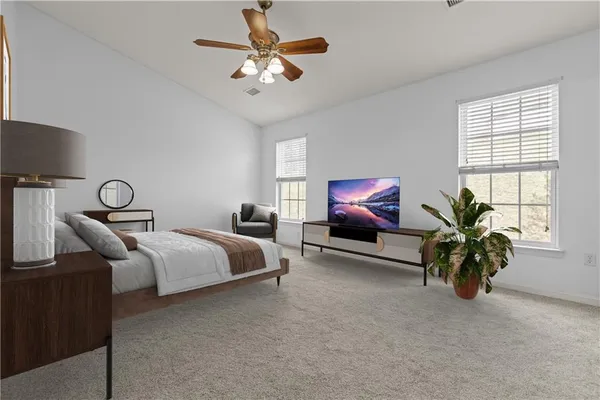 a bedroom with furniture and a chandelier