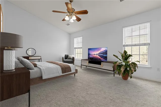a bedroom with furniture and a chandelier