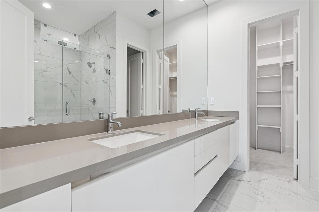 3048 ChImes Street Dallas, TX 75219 - Photo 15 of 35 a bathroom with a granite countertop sink and a mirror