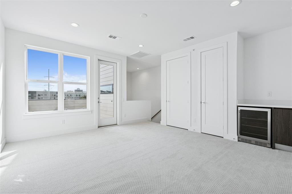 3048 ChImes Street Dallas, TX 75219 - Photo 21 of 35 a view of an empty room with a window