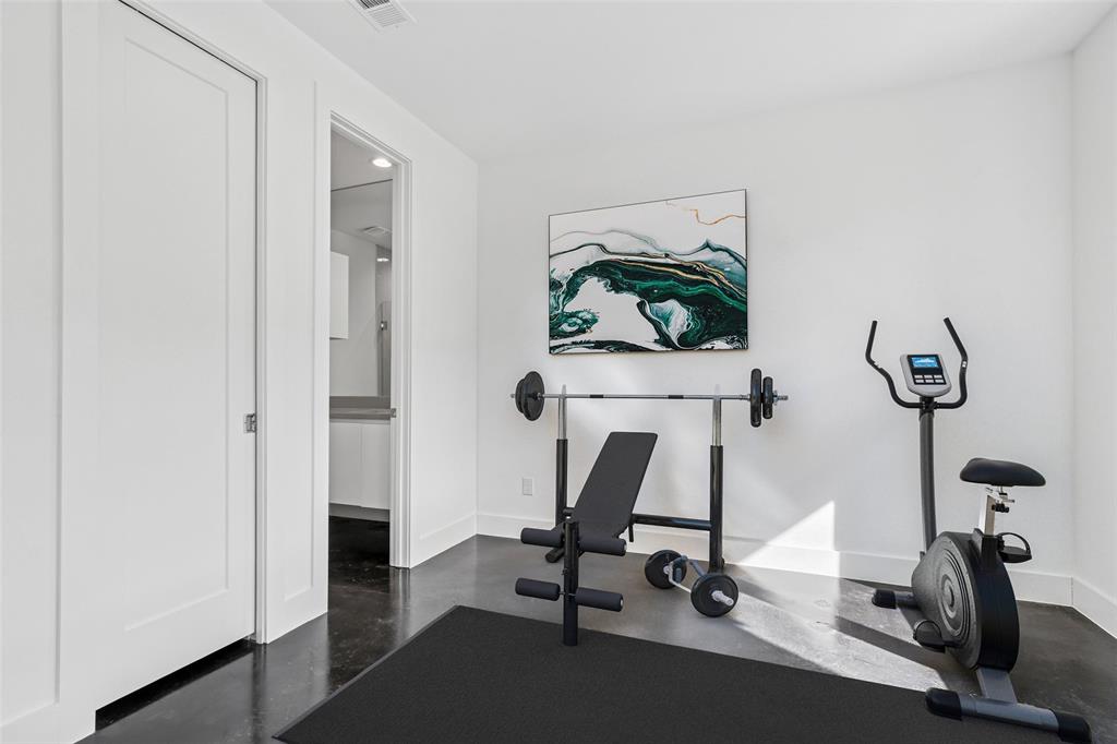 3048 ChImes Street Dallas, TX 75219 - Photo 24 of 35 a view of a workspace with gym equipment