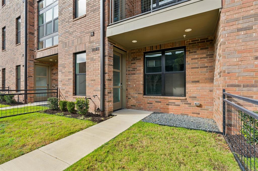 3048 ChImes Street Dallas, TX 75219 - Photo 3 of 35 a front view of a house with a yard