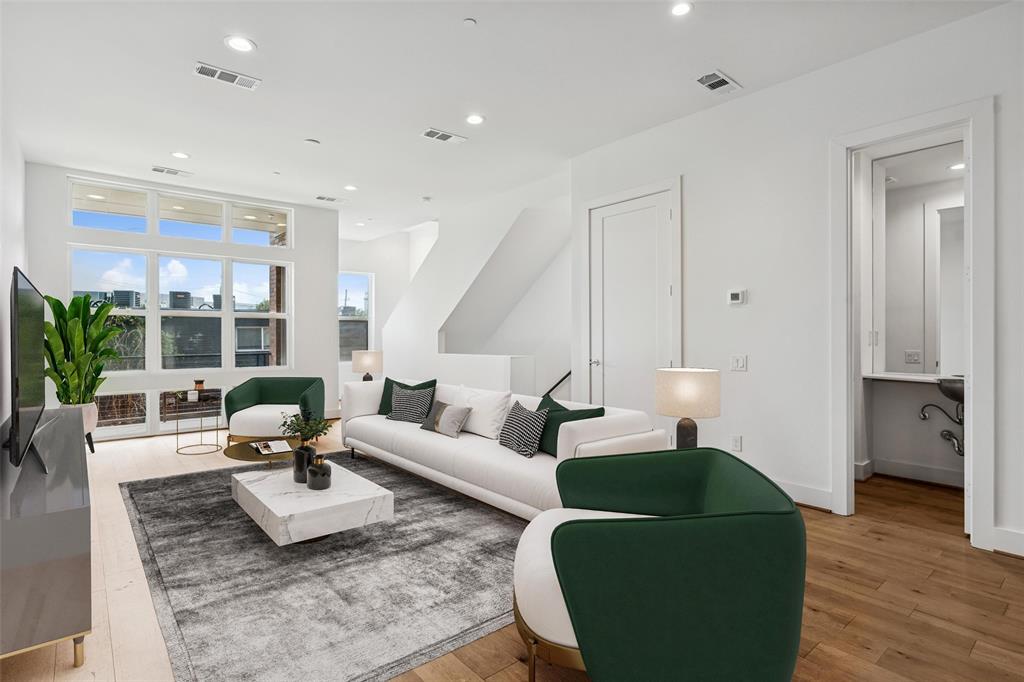 3048 ChImes Street Dallas, TX 75219 - Photo 4 of 35 a living room with furniture window and wooden floor