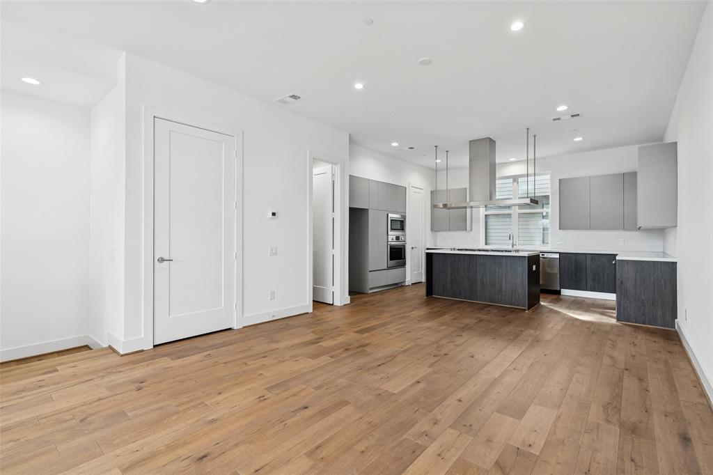 3048 ChImes Street Dallas, TX 75219 - Photo 7 of 35 a view of a kitchen with a sink and a refrigerator