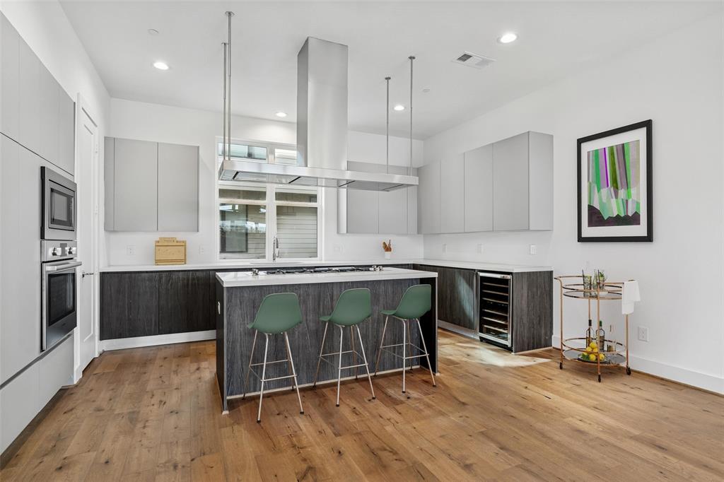 3048 ChImes Street Dallas, TX 75219 - Photo 8 of 35 a kitchen with a counter top appliances and a window