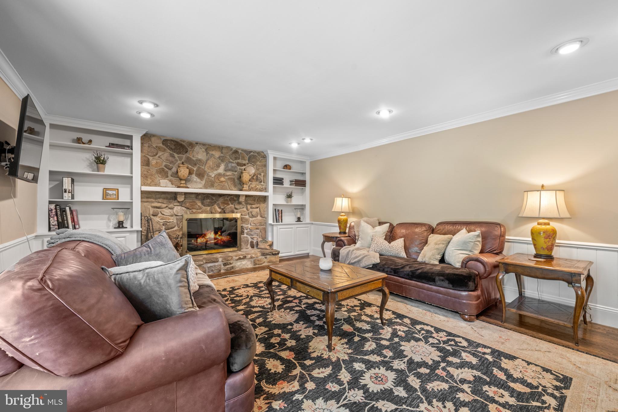 1064 Beaumont Road Berwyn, PA 19312 - Photo 12 of 41 Stone Surround Fireplace flanked by Built-In Cabs