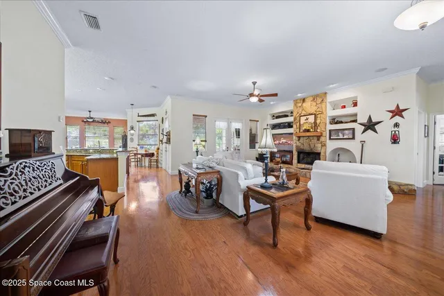 a living room with furniture or couch and a wooden floor