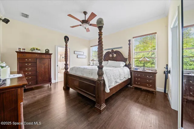 a living room with furniture a fireplace and a large window