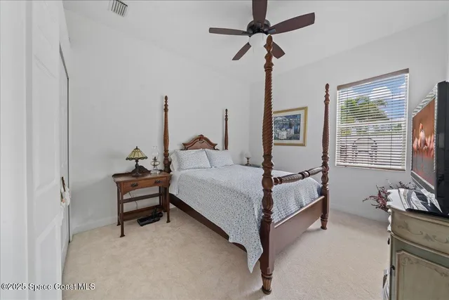 a livingroom with workspace and a window