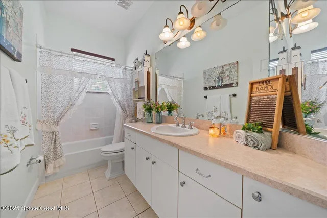 a bedroom with a bed dresser and a window