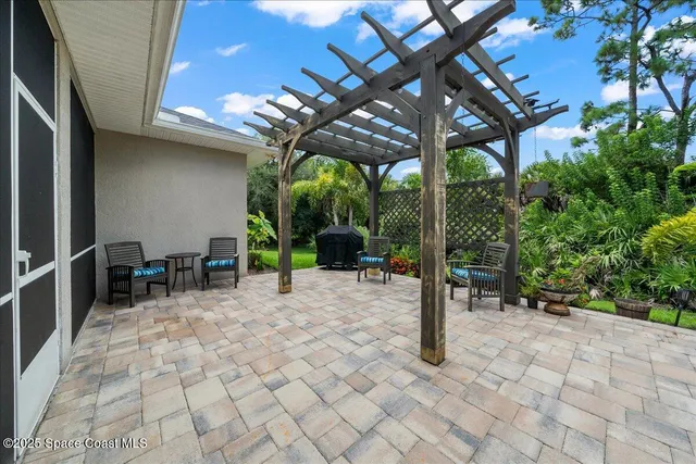 a living room with furniture a fireplace and a window