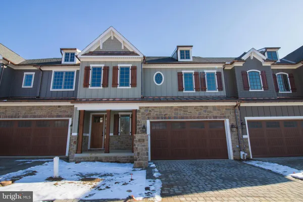 a front view of a house with yard