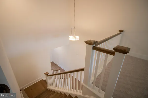 a view of a hallway with stairs