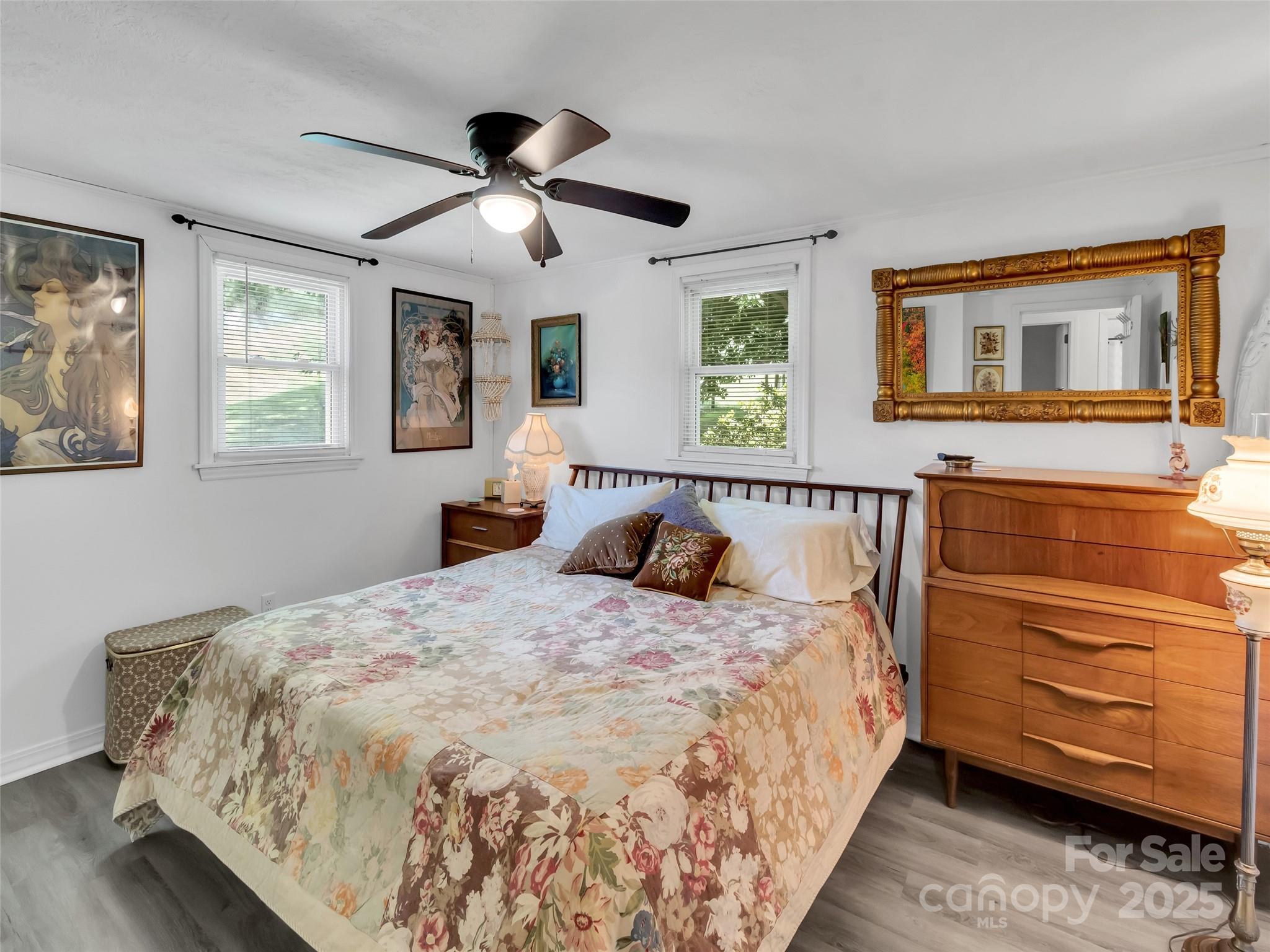 340 Mauney Cove Road Waynesville, NC 28786 - Photo 14 of 35 a bed sitting in a bedroom next to a window