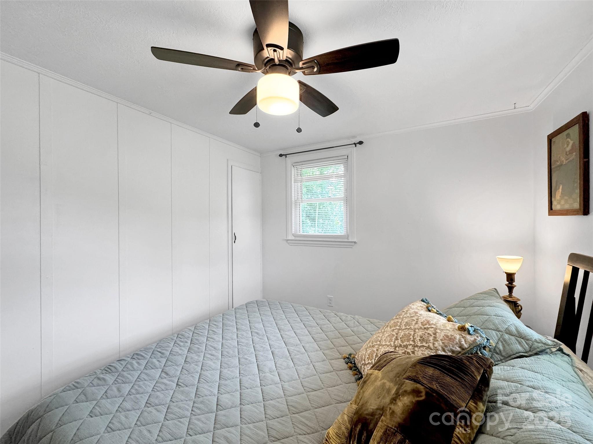 340 Mauney Cove Road Waynesville, NC 28786 - Photo 18 of 35 a bedroom with bed and a window