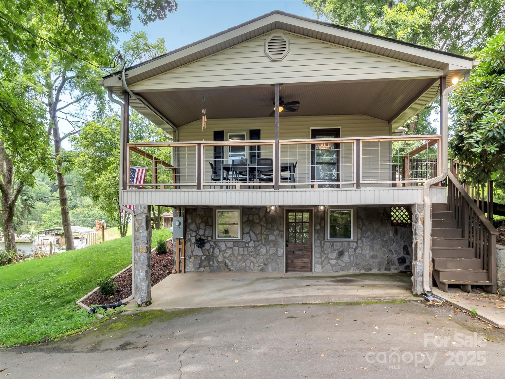 340 Mauney Cove Road Waynesville, NC 28786 - Photo 2 of 35 front view of a house with a porch