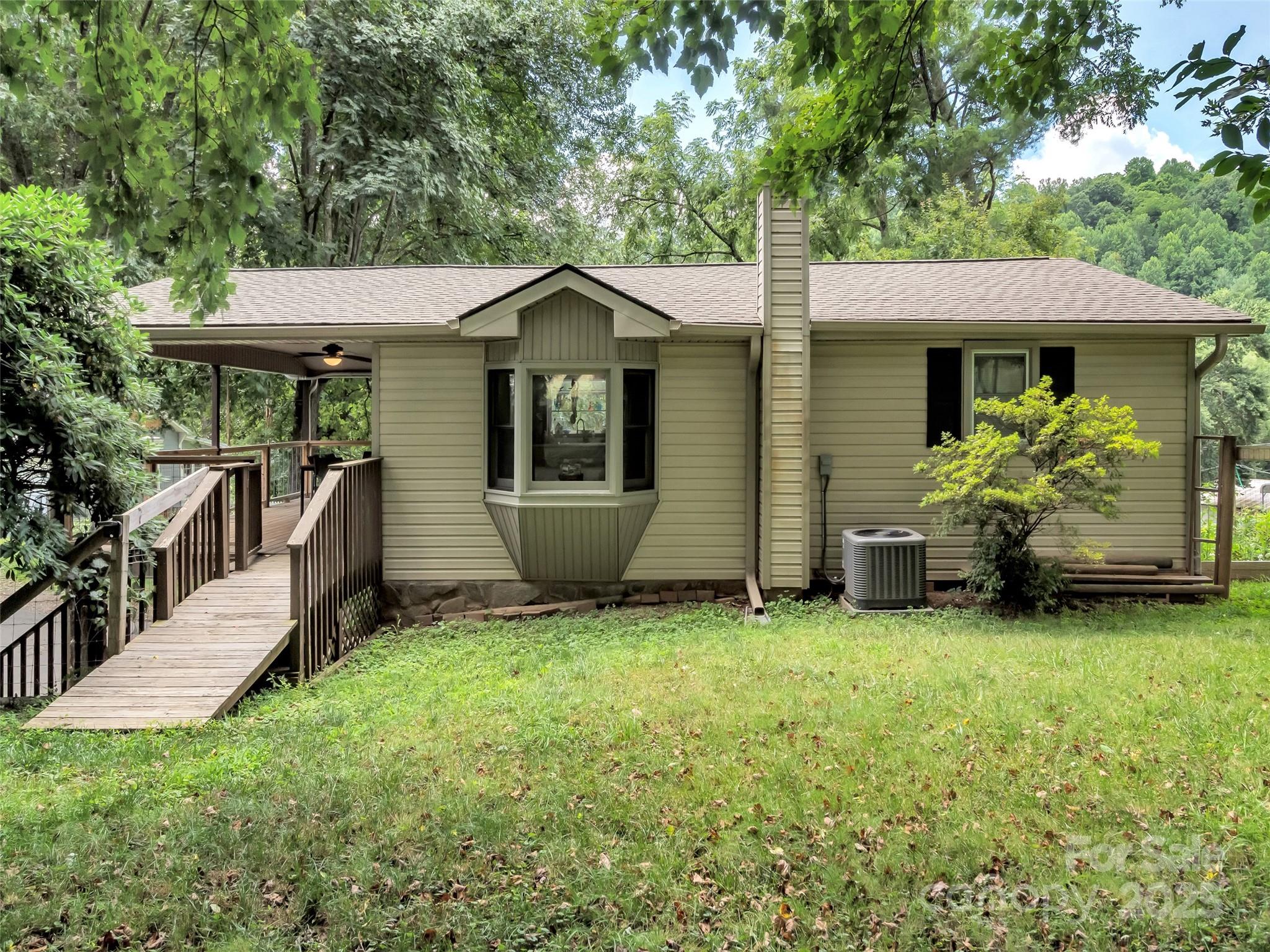 340 Mauney Cove Road Waynesville, NC 28786 - Photo 30 of 35 a front view of a house with a yard