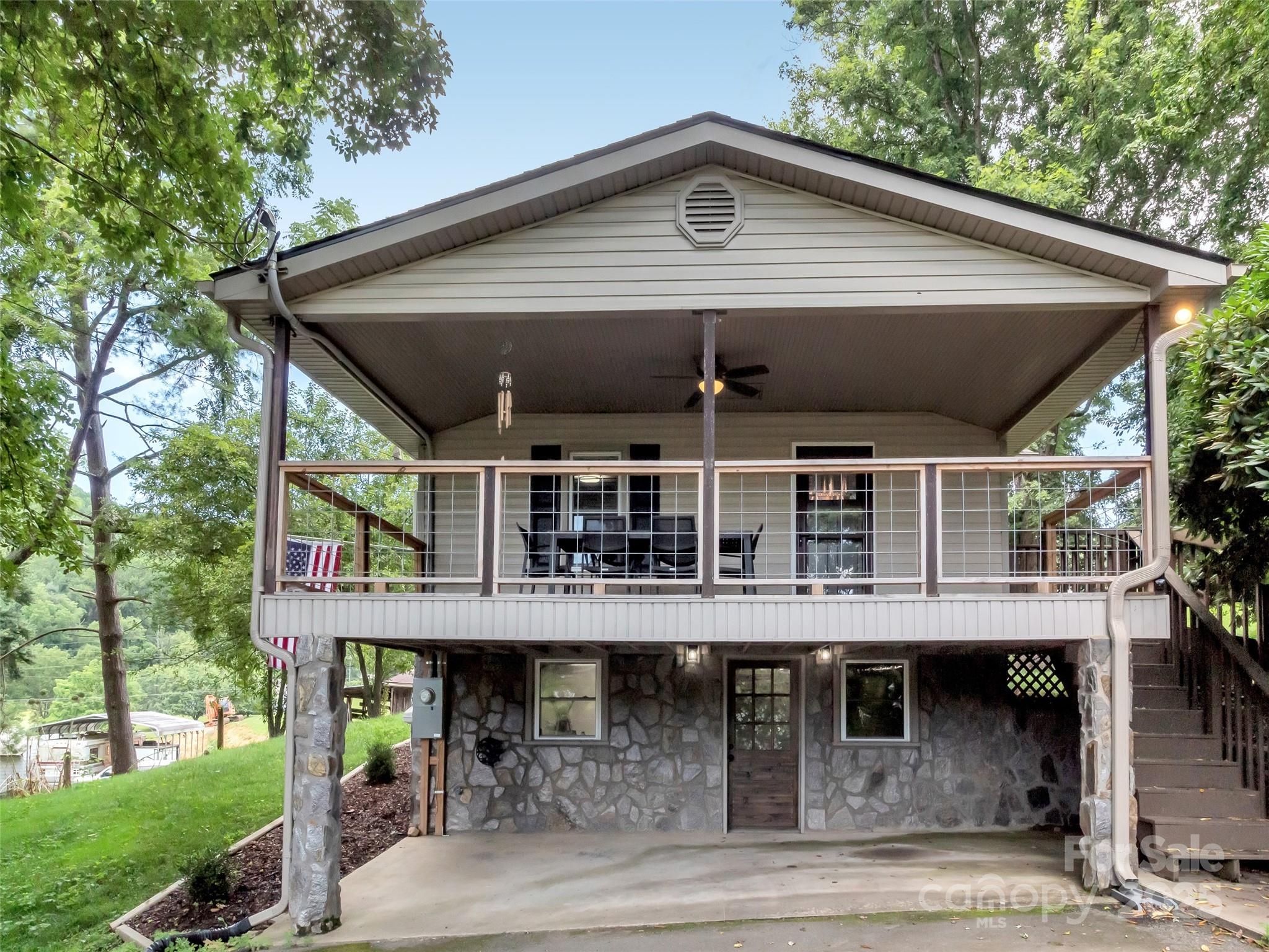 340 Mauney Cove Road Waynesville, NC 28786 - Photo 33 of 35 a front view of a house with porch