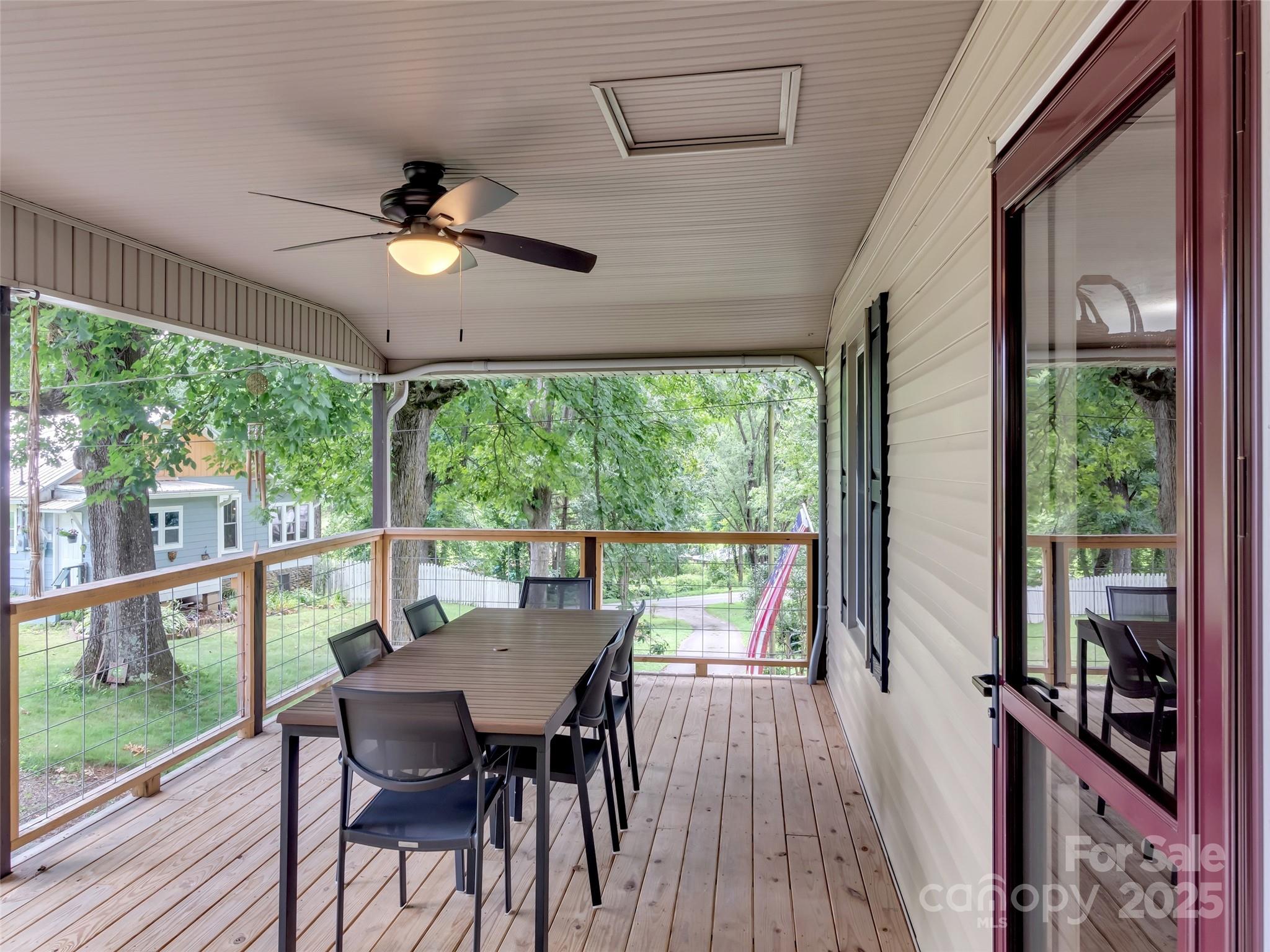 340 Mauney Cove Road Waynesville, NC 28786 - Photo 6 of 35 a view of a dining room with furniture window and wooden floor
