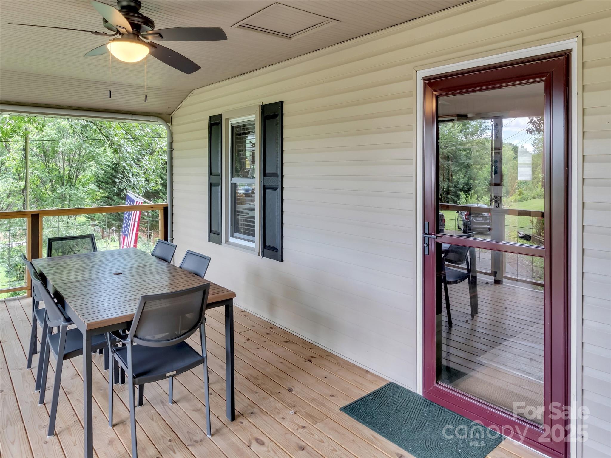 340 Mauney Cove Road Waynesville, NC 28786 - Photo 7 of 35 a view of a dining room with furniture window and outside view