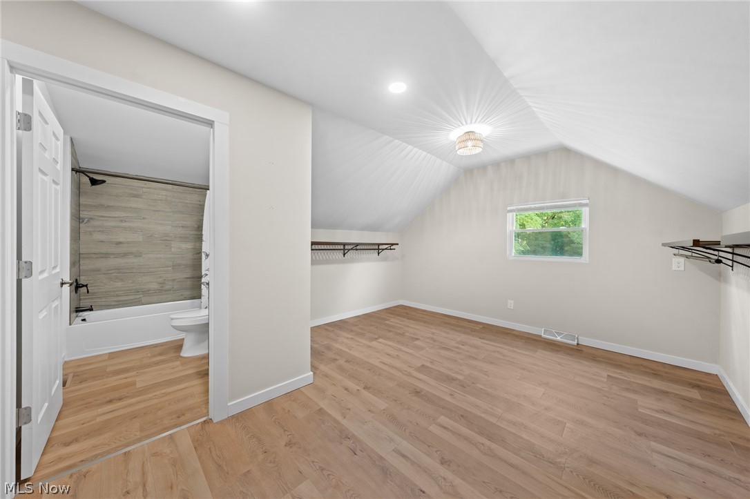 1617 Graham Road Stow, OH 44224 - Photo 42 of 49 Bonus room with light wood-type flooring and lofted ceiling