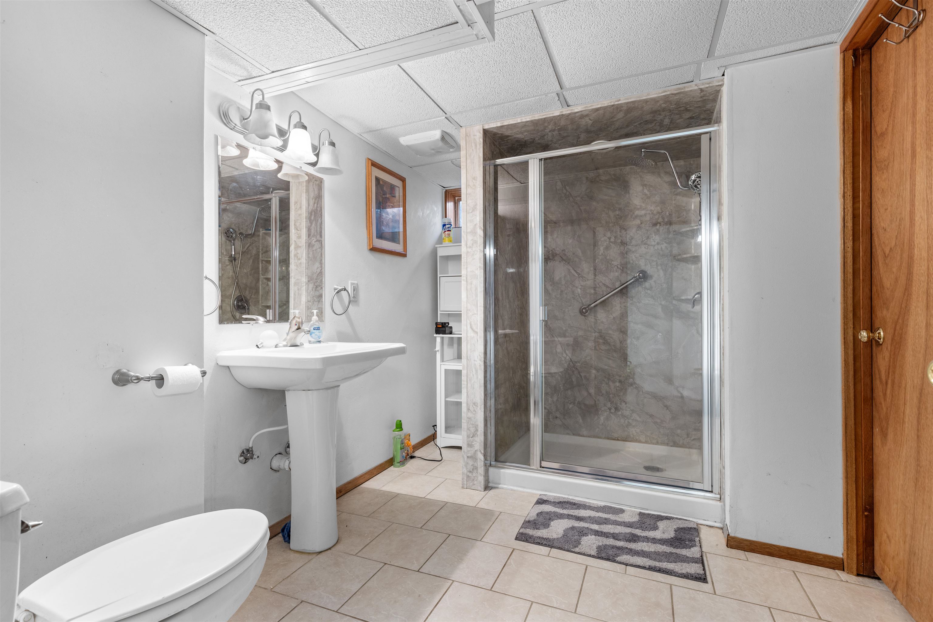 4193 Old Gate Road Rockford, IL 61109 - Photo 11 of 18 a bathroom with a sink toilet and shower