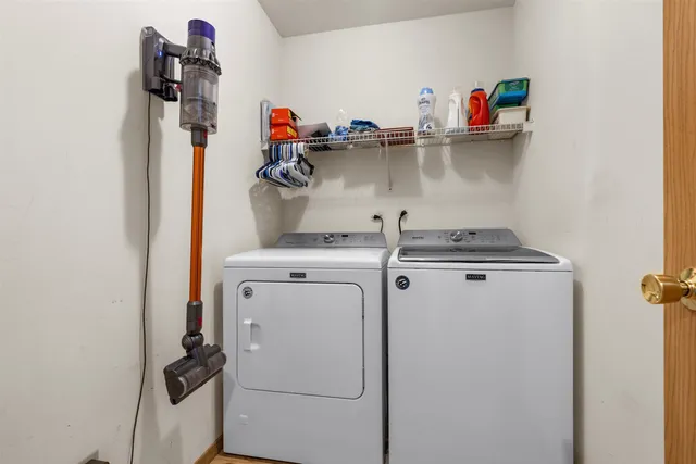 a storage and utility room with washer and dryer