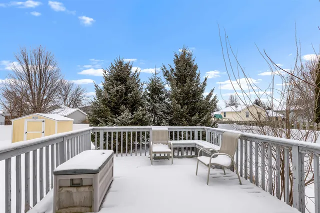 a view of a chair and tables in the balcony