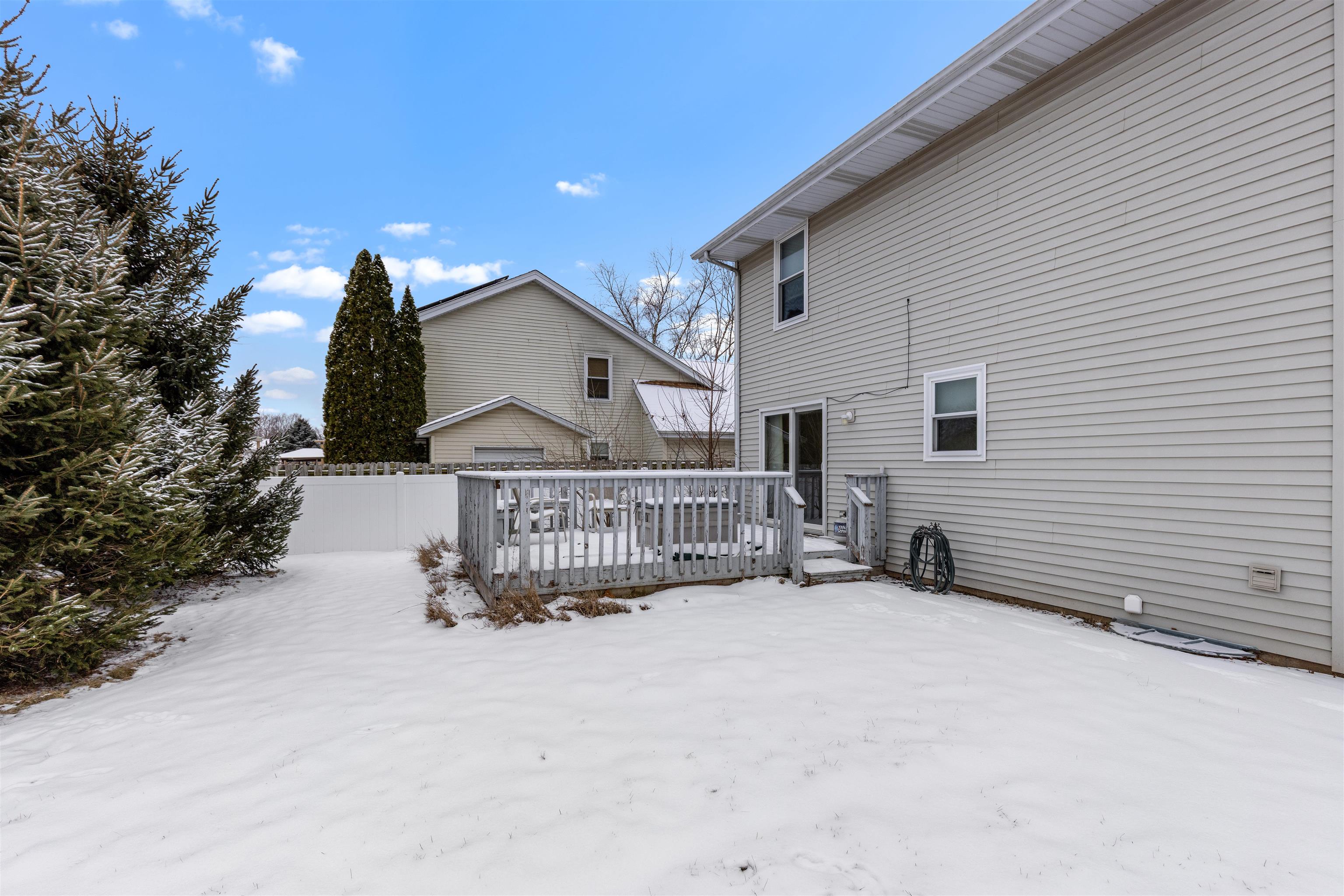 4193 Old Gate Road Rockford, IL 61109 - Photo 16 of 18 a view of a house with a wooden fence
