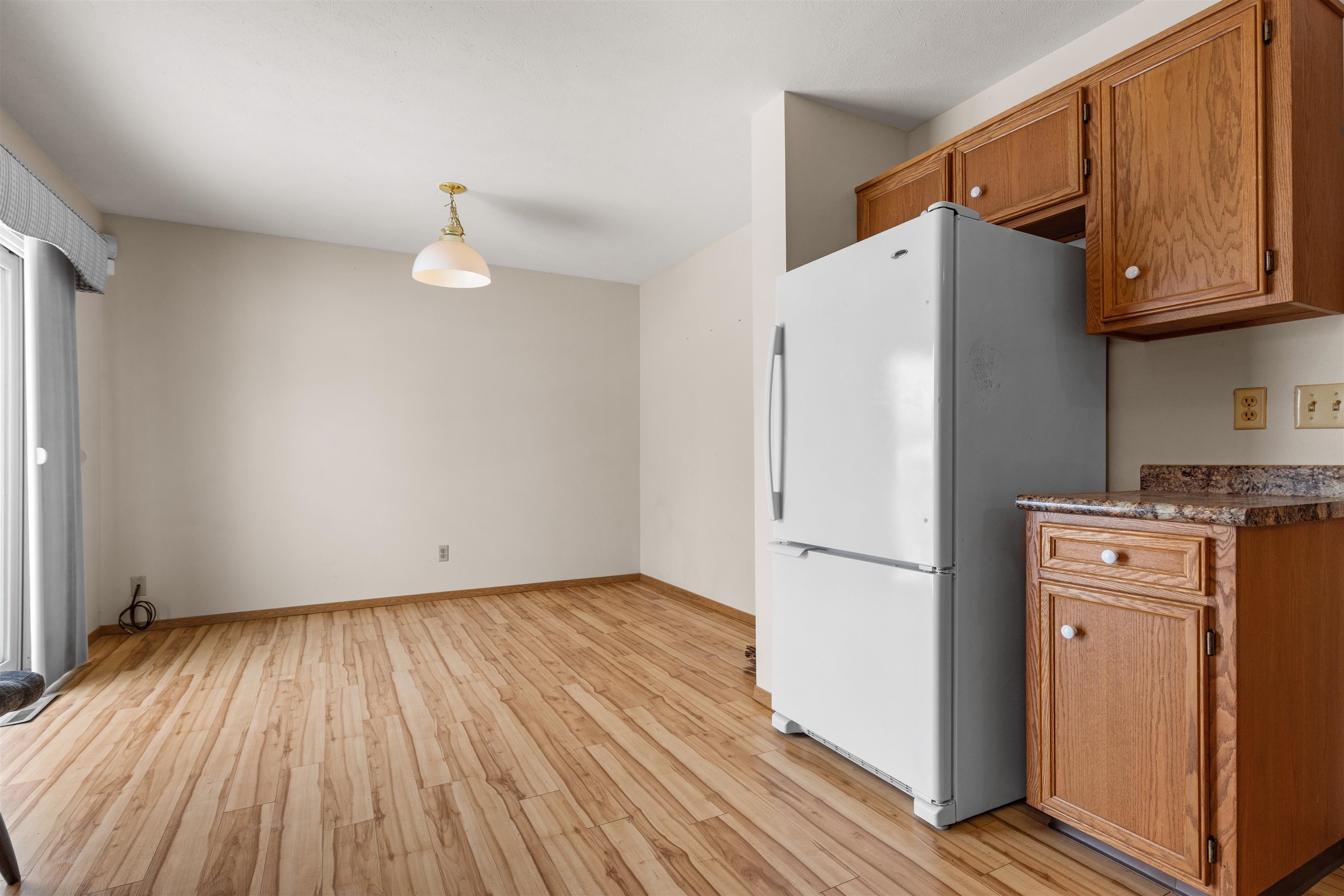 4193 Old Gate Road Rockford, IL 61109 - Photo 2 of 18 a view of a kitchen with wooden floor and a refrigerator