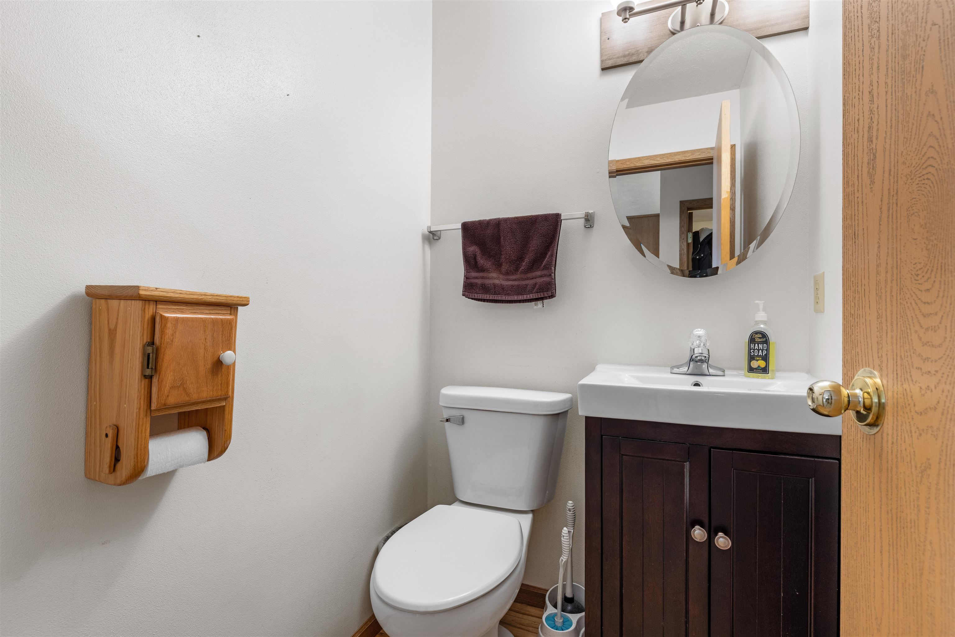 4193 Old Gate Road Rockford, IL 61109 - Photo 6 of 18 a bathroom with a toilet a sink and mirror