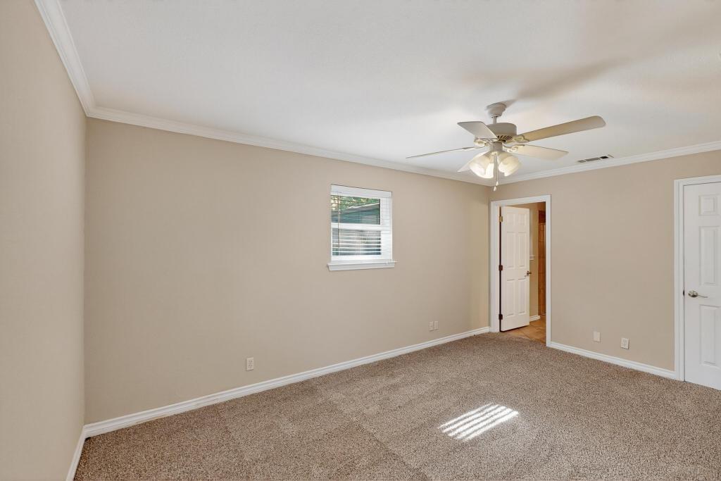 1505 Cedar Ridge Terrace Euless, TX 76039 - Photo 18 of 38 a view of an empty room with a chandelier fan