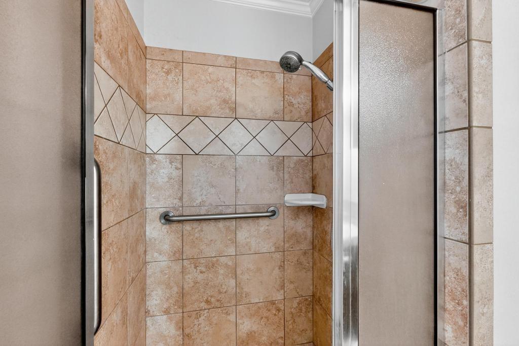 1505 Cedar Ridge Terrace Euless, TX 76039 - Photo 26 of 38 a bathroom with a shower