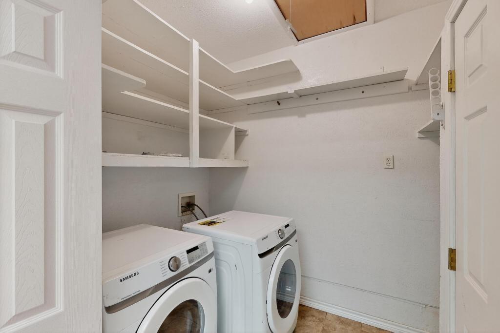 1505 Cedar Ridge Terrace Euless, TX 76039 - Photo 27 of 38 a view of storage and utility room with washer and dryer