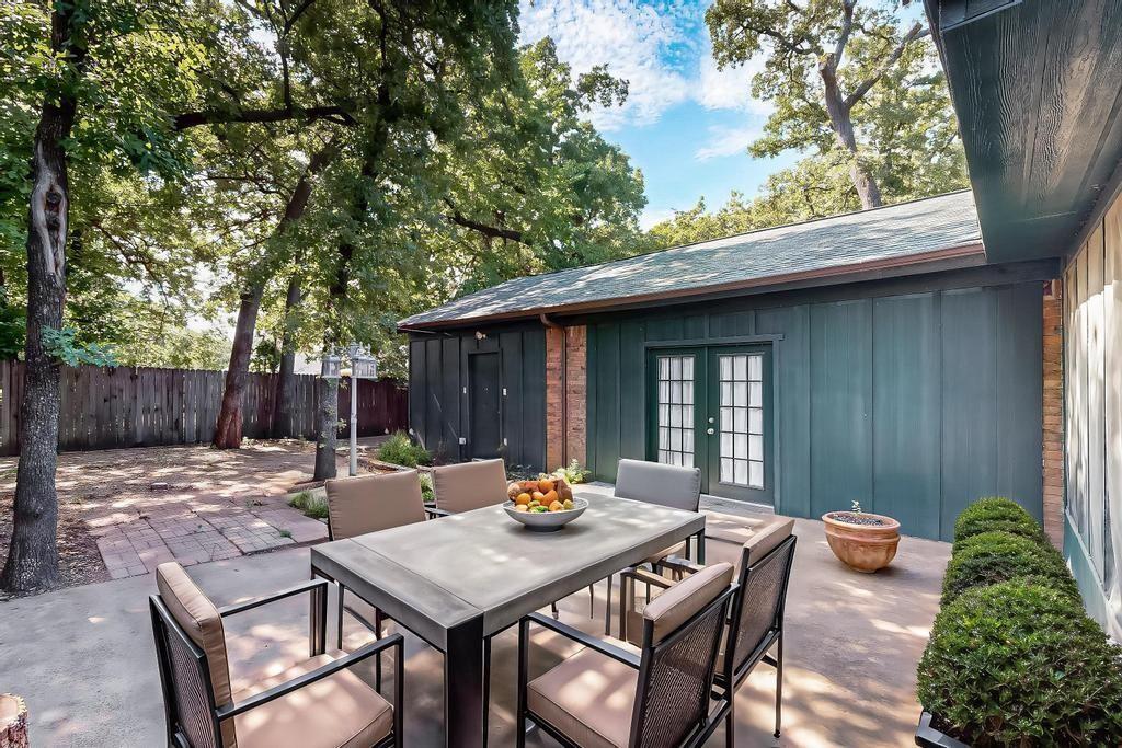 1505 Cedar Ridge Terrace Euless, TX 76039 - Photo 29 of 38 a backyard of a house with table and chairs
