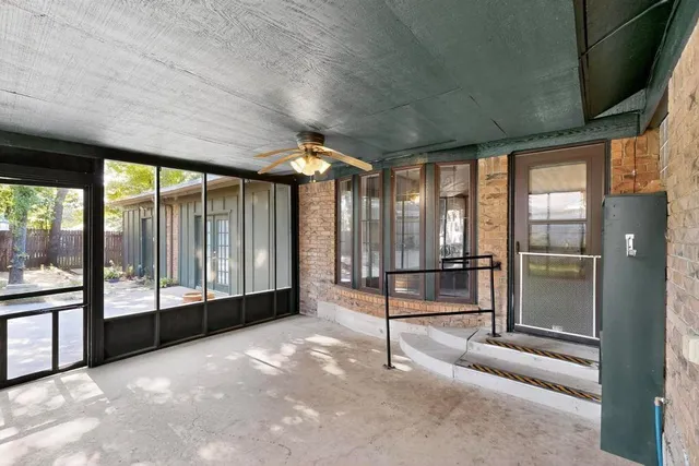 a view of an empty room with a large window