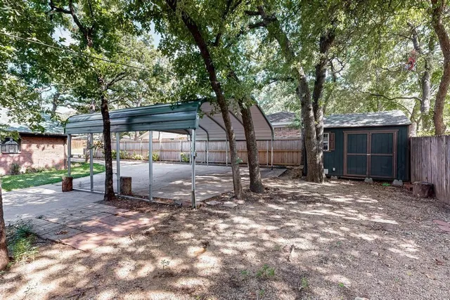 a kitchen with stainless steel appliances and white cabinets