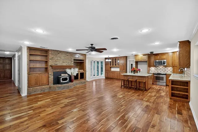 a living room with furniture and a kitchen view