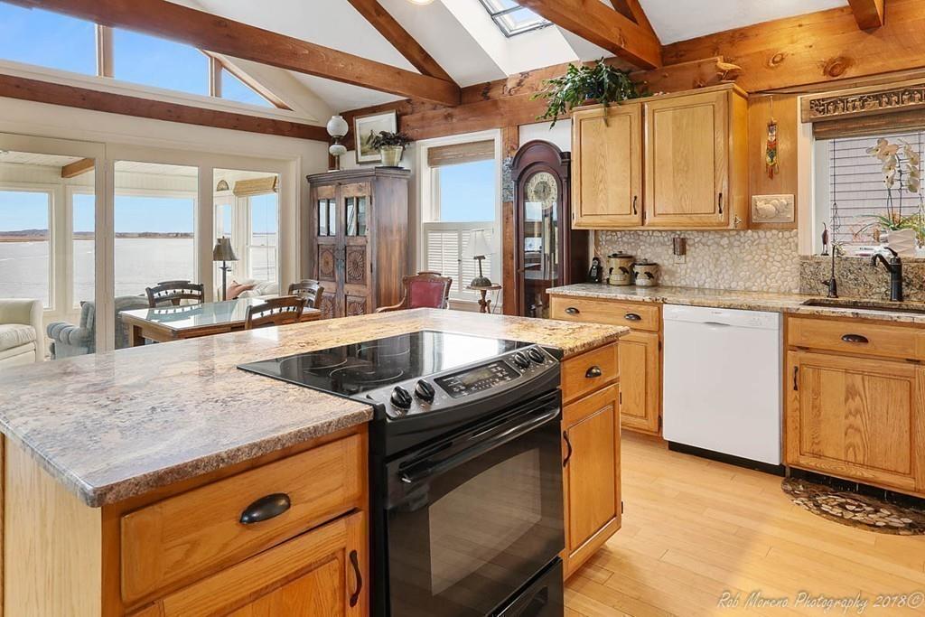 36 North Ridge Road Ipswich, MA 01938 - Photo 13 of 42 a kitchen with a stove a sink and a refrigerator